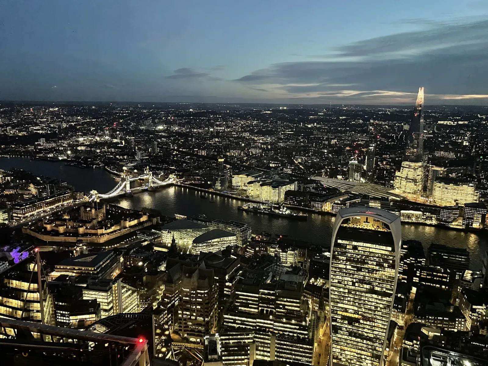 River city at dusk seen from high inside a tower.
